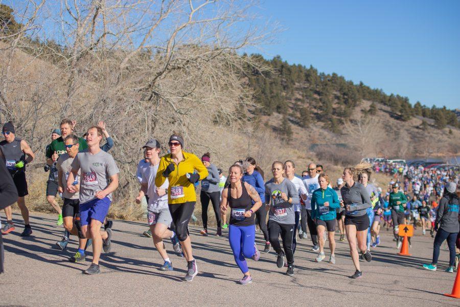 Runners run up the first hill of the Polar Bear Run and Plunge five kilometer race, on Jan 25 2020. (Devin Cornelius | Collegian)