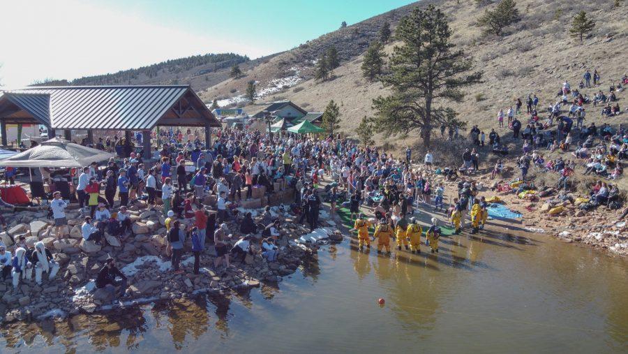 Spectators watch as the participants of the Front Range Freeze's Polar Bear Run and Plunge, during the Polar Plank Off on Jan 25, 2020. (Devin Cornelius | Collegian)