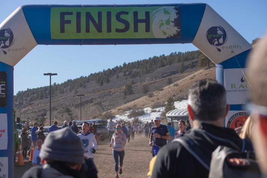 Runners finish the five kilometer race around the Horsetooth, as they participate in the Front Range Freeze's Polar Bear Run and Plunge on January 25th 2020. (Devin Cornelius | Collegian)