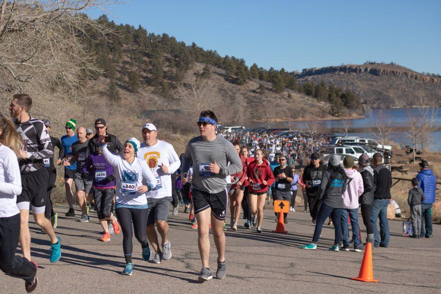 Two runner take a selfie as they participate in the five kilometer  Polar Bear Run and Plunge race on Jan 20 2020.(Devin Cornelius | Collegian)