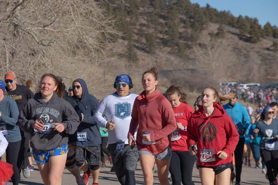 Runners run up the first hill of the Polar Bear Run and Plunge five kilometer race, on Jan 25 2020. (Devin Cornelius | Collegian)