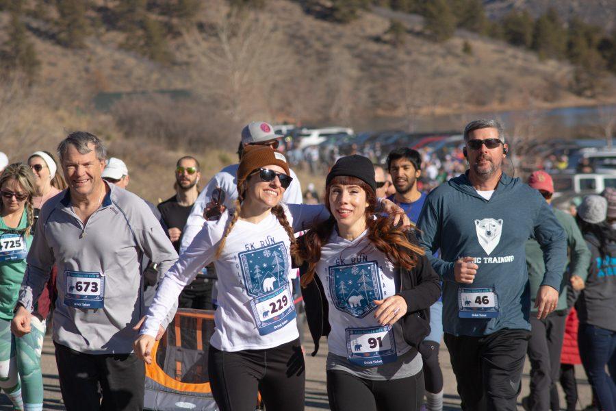 Runners smile as they begin the Polar Bear Run and Plunge at Horsetooth Reservoir on Jan 25 2020. (Devin Cornelius | Collegian)
