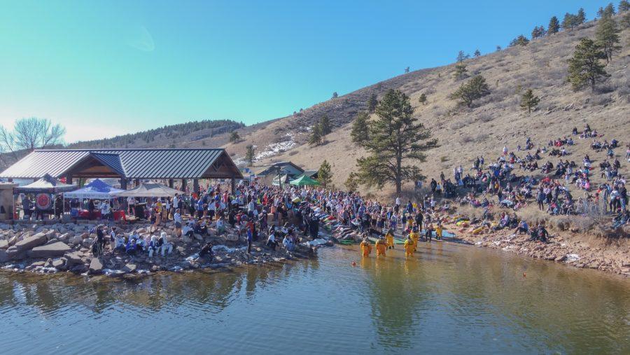 Spectators watch as the participants of the Front Range Freeze's Polar Bear Run and Plunge, during the Polar Plank Off on Jan 25, 2020.  (Devin Cornelius | Collegian)