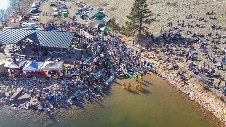 Spectators watch as the participants of the Front Range Freeze's Polar Bear Run and Plunge, during the Polar Plank Off on Jan 25, 2020. (Devin Cornelius | Collegian)