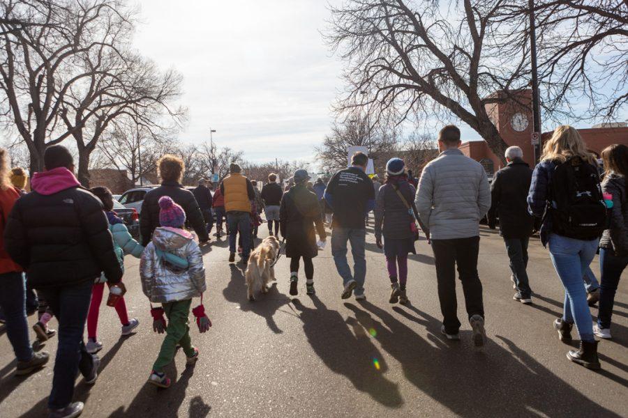 Members of the Fort Collins community gather downtown for a march to the Colorado State University Lory Student Center in celebration of Dr. Martin Luther King Jr. Day. (Brooke Buchan | The Collegian) 