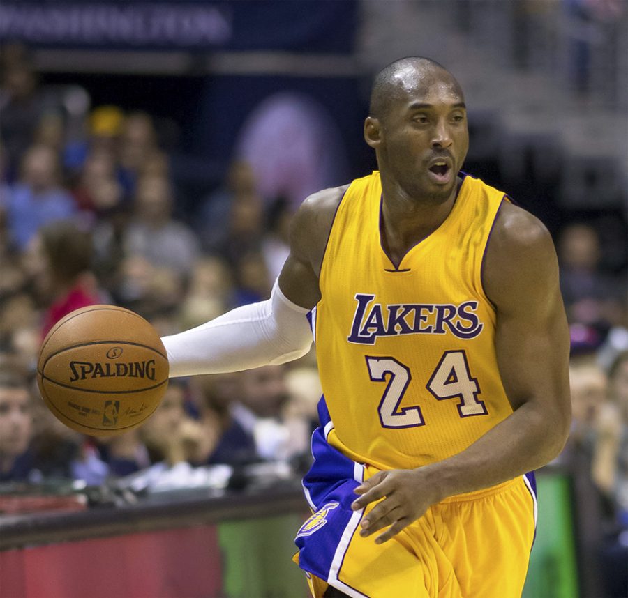 sidebar: Kobe Bryant dribbles the ball while playing for the Los Angeles Lakers Dec. 3, 2014. (Photo via Keith Allison, Flickr)
