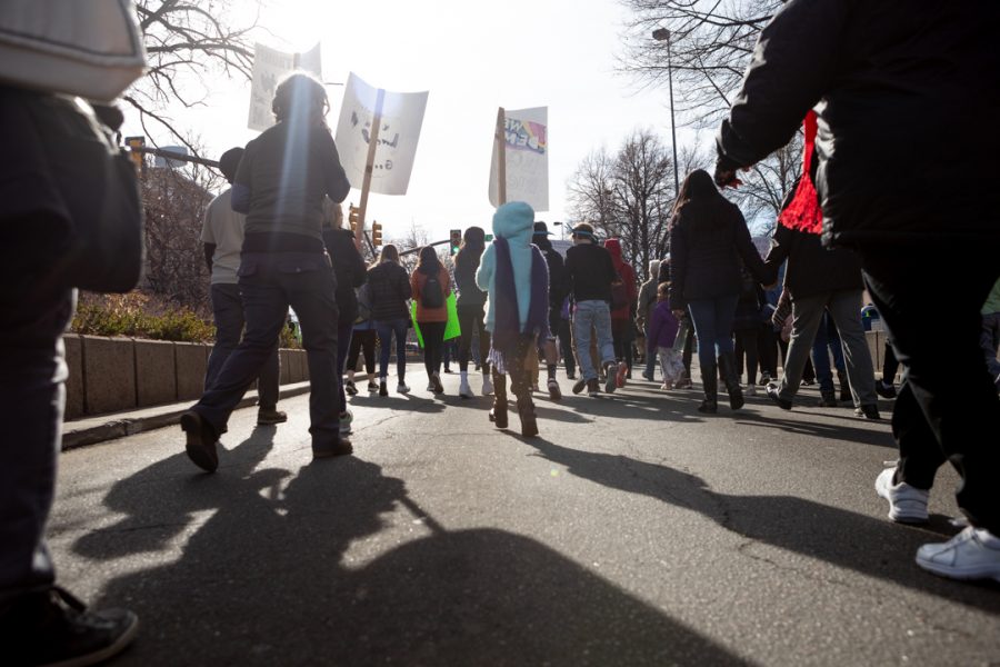 Members of the Fort Collins community gather downtown for a march to the Colorado State University Lory Student Center in celebration of Dr. Martin Luther King Jr. Day. (Brooke Buchan | The Collegian) 