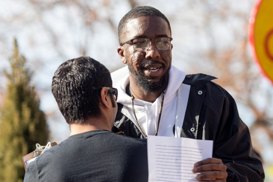 Malik Burton, a graduate student in the College of Health and Human Sciences, speaks at the Dr. Martin Luther King Jr. downtown march Monday, Jan. 20. (Brooke Buchan | The Collegian)