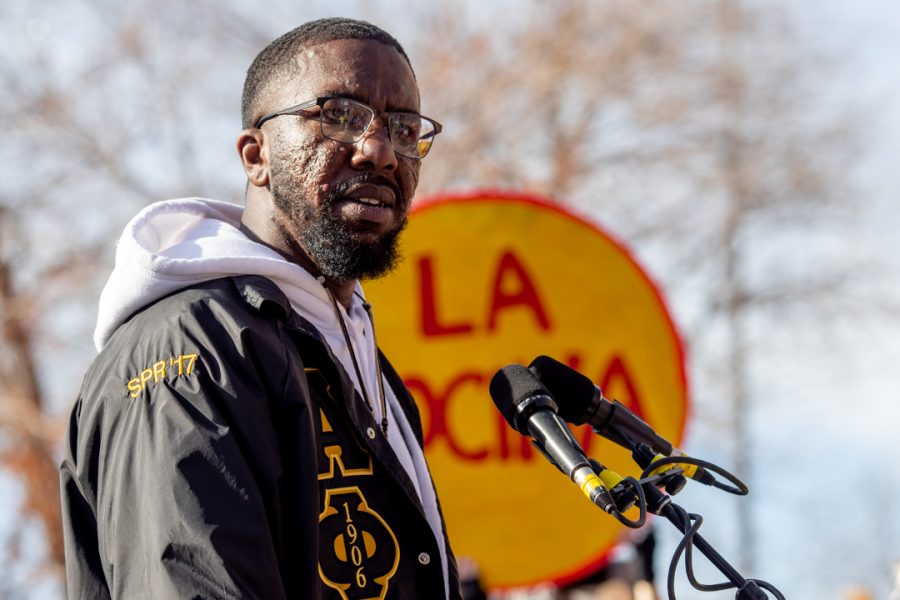 Malik Burton, a graduate student in the College of Health and Human Sciences, speaks at the Dr. Martin Luther King Jr. downtown march Monday, Jan. 20. (Brooke Buchan | The Collegian)
