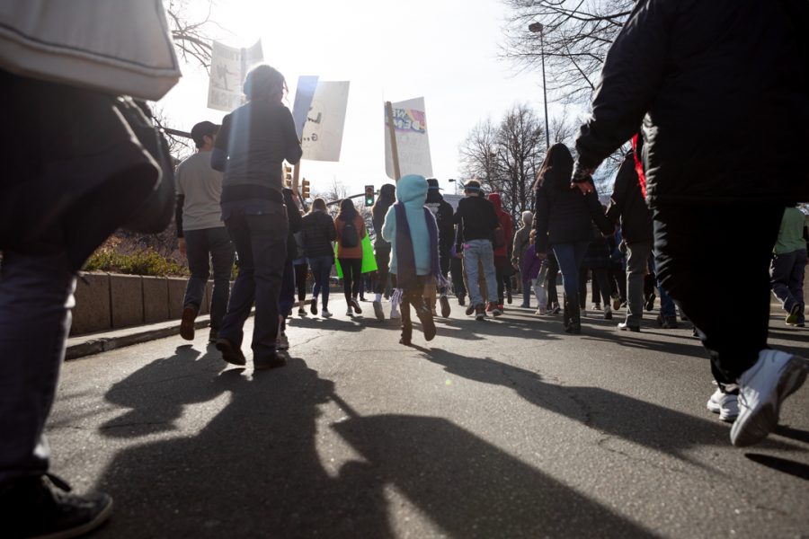 Members of the Fort Collins community gather downtown for a march to the Colorado State University Lory Student Center in celebration of Dr. Martin Luther King Jr. Day. (Brooke Buchan | The Collegian) 