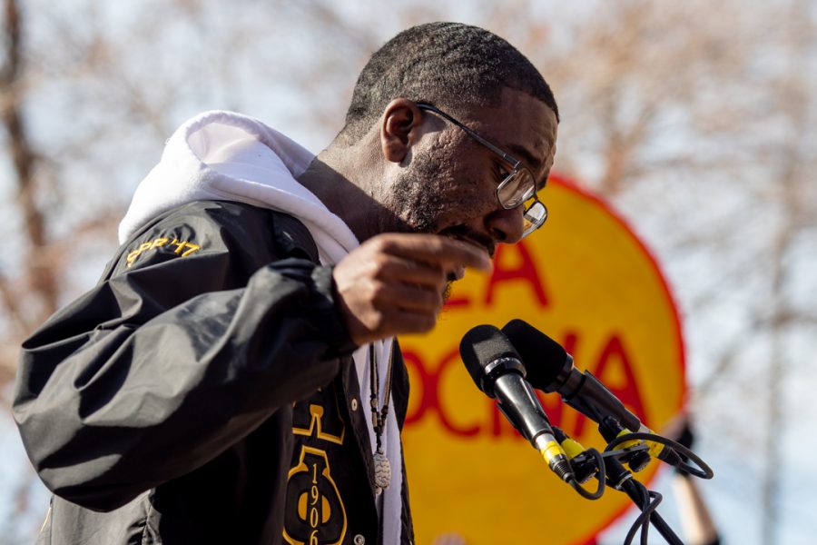 Malik Burton, a graduate student in the College of Health and Human Sciences, speaks at the Dr. Martin Luther King Jr. downtown march Monday, Jan. 20. (Brooke Buchan | The Collegian)