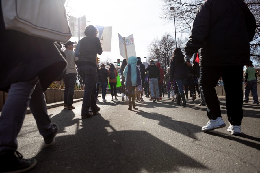 Members of the Fort Collins community gather downtown for a march to the Colorado State University Lory Student Center in celebration of Dr. Martin Luther King Jr. Day. (Brooke Buchan | The Collegian) 
