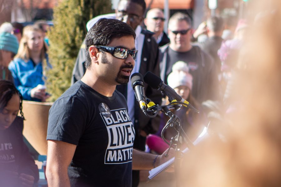 Lory Student Center Program Coordinator, Ali Raza, speaks at the Dr. Martin Luther King Jr. downtown march Monday, Jan. 20. (Brooke Buchan | The Collegian)