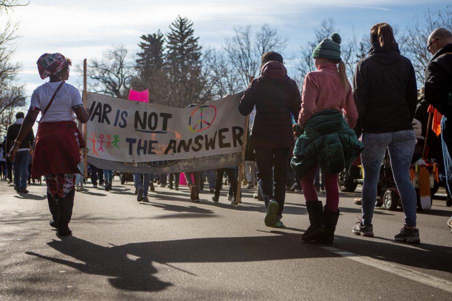 Members of the Fort Collins community gather downtown for a march to the Colorado State University Lory Student Center in celebration of Dr. Martin Luther King Jr. Day. (Brooke Buchan | The Collegian) 