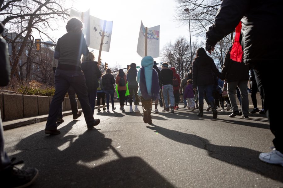 Members of the Fort Collins community gather downtown for a march to the Colorado State University Lory Student Center in celebration of Dr. Martin Luther King Jr. Day. (Brooke Buchan | The Collegian) 