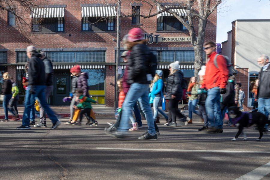 Members of the Fort Collins community gather downtown for a march to the Colorado State University Lory Student Center in celebration of Dr. Martin Luther King Jr. Day. (Brooke Buchan | The Collegian) 