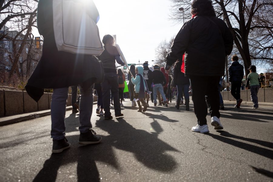 Members of the Fort Collins community gather downtown for a march to the Colorado State University Lory Student Center in celebration of Dr. Martin Luther King Jr. Day. (Brooke Buchan | The Collegian) 
