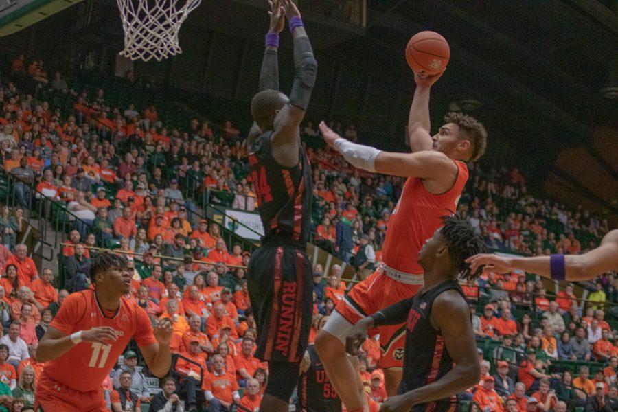 David Roddy (21) drives past defenders and jumps towards the basket, during the Colorado State game vs the University of Nevada, Las Vegas. CSU wins 95 - 77. (Devin Cornelius | Collegian)