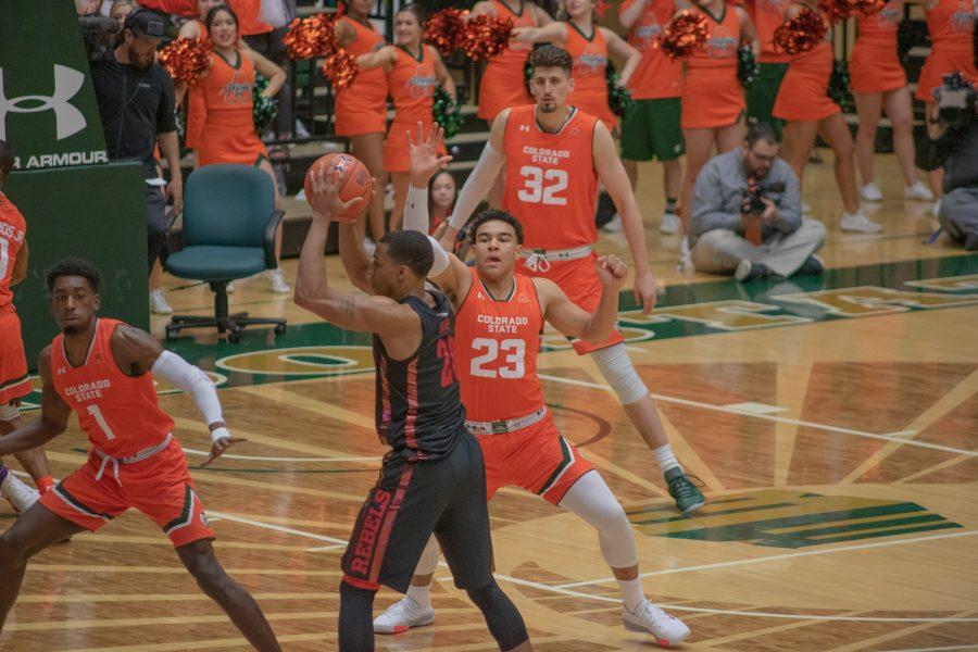 Jon Tonje (23) attempts to stop the opponent's pass, during the Colorado State's home game against the University of Nevada, Las Vegas. CSU wins 95-77. (Devin Cornelius | Collegian)