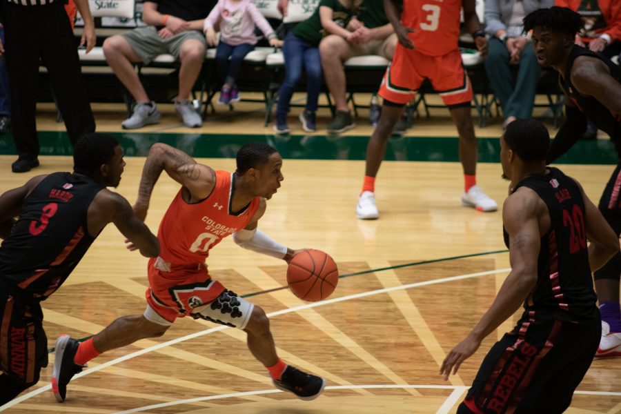 Hyron Edwards (0) drives past one defender toward the basket, during the Colorado State game against the University of Nevada, Las Vegas. CSU wins 95-77. (Devin Cornelius | Collegian)