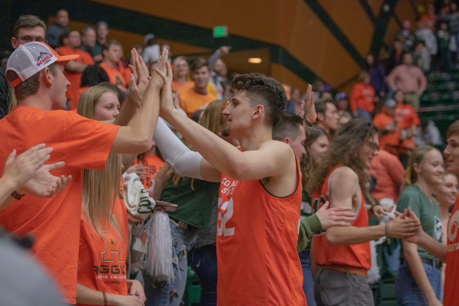Nico Carvacho (32) gives out high fives, after the Colorado State game against the University of Nevada, Las Vegas. CSU wins 95-77.  (Devin Cornelius | Collegian)
