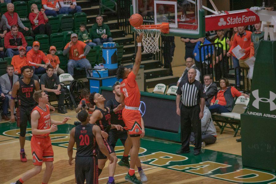 Dischon Thomas (11) drops the ball into the hoop, during the Colorado State home game vs the University of Nevada, Las Vegas. CSU wins 95-77. (Devin Cornelius | Collegian)
