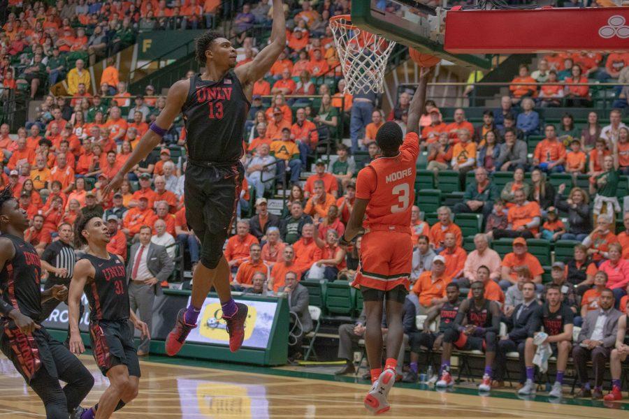 Kendle Moore (3) drives around several defenders and shoots a behind the back layup, during the Colorado State game against the University of Nevada, Las Vegas. CSU wins 95-77. (Devin Cornelius | Collegian)