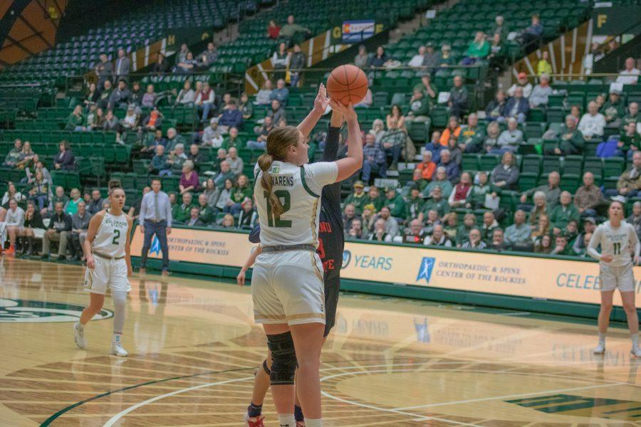 Jamie Bonnarens (12) shoots the ball over a defender, during the University home game vs Fresno State University on Feb 5, 2020, CSU falls 79-61.  (Devin Cornelius | Collegian)
