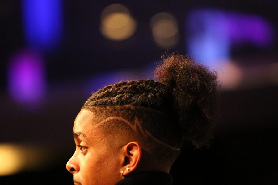 Christian Williams looks out over the crowd at the end of the United Women of Color Hair Show in the Lory Student Center Feb. 9. Williams traveled to Colorado State University from the University of Northern Colorado to watch the show and support his friends who were participating. (Forrest Czarnecki | The Collegian)