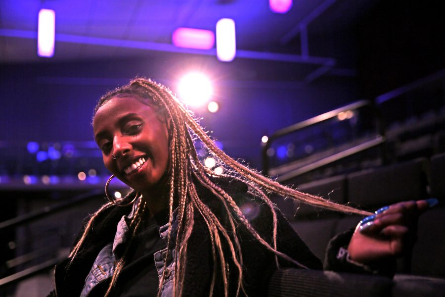 Hanggatu Abdullahi shows off her box braids following the United Women of Color Hair Show in the Lory Student Center Theatre Feb. 9. Abdullahi traveled from the University of Northern Colorado to watch the show and support her friends who were competing. (Forrest Czarnecki | The Collegian)