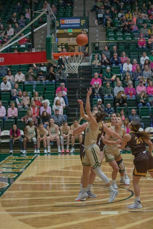 Tori Williams (2) drives past several defenders and shoots a layup, during the University's home game against Wyoming on Feb 15, 2020. CSU loses 43-40. (Devin Cornelius | Collegian)