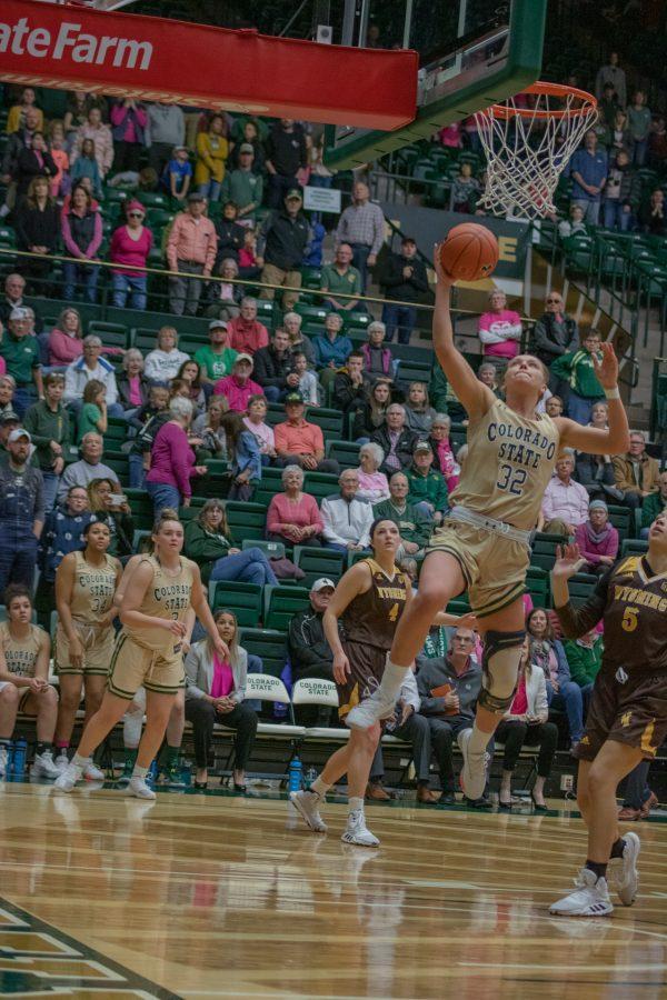 Andrea Brady (32) shoots a layup after driving past defenders, during the University home game against Wyoming on Feb 15, 2020. CSU falls 43-40. (Devin Cornelius | Collegian)