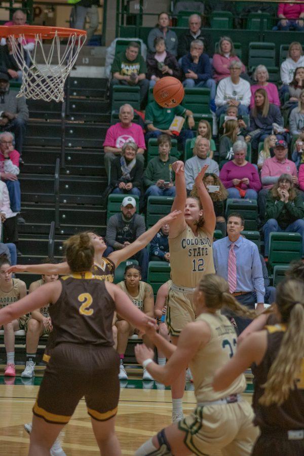 Jamie Bonnarens (12) Shoots a three pointer, during the Colorado State home game against the University of Wyoming on Feb 15, 2020. CSU loses  43-40. (Devin Cornelius | Collegian)