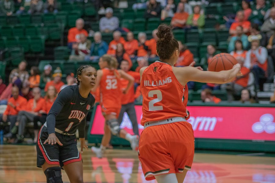 Colorado State Guard Tori Williams (2) passes the ball to a teammate while being guarded, during the CSU home game against the University of Las Vegas, Nevada. CSU wins 60-56.(Devin Cornelius | Collegian)