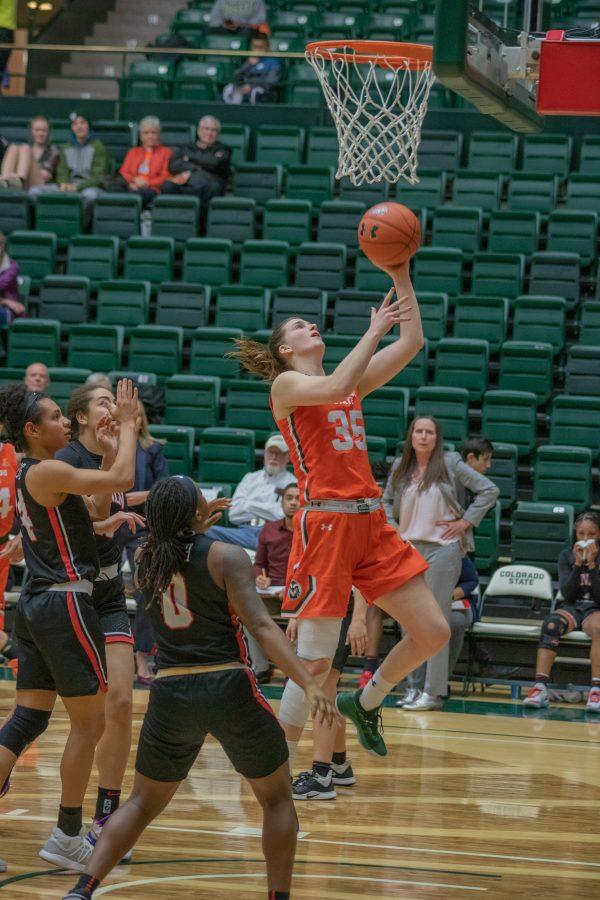 Lore Devos (35) drives past several defenders and makes a layup, during the Colorado State home game vs the University of Las Vegas, Nevada on Feb 19, 2020. CSU wins 60-56. (Devin Cornelius | Collegian)
