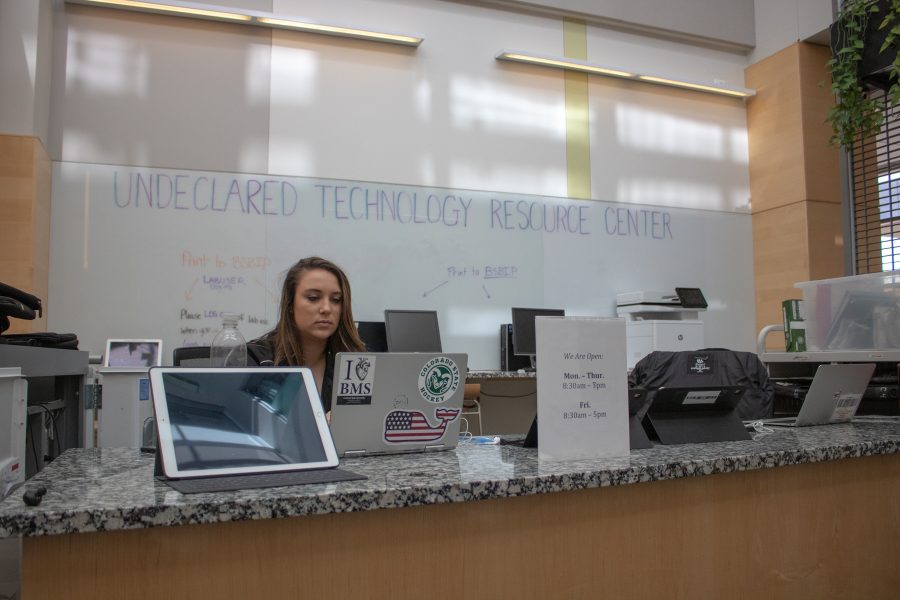 Madi Lacy works on her computer at the Undeclared technology resource center in the Behavioral Sciences building. You can check out a laptop and use the printer here if you are an undeclared student at Colorado State. (Devin Cornelius | The Collegian)