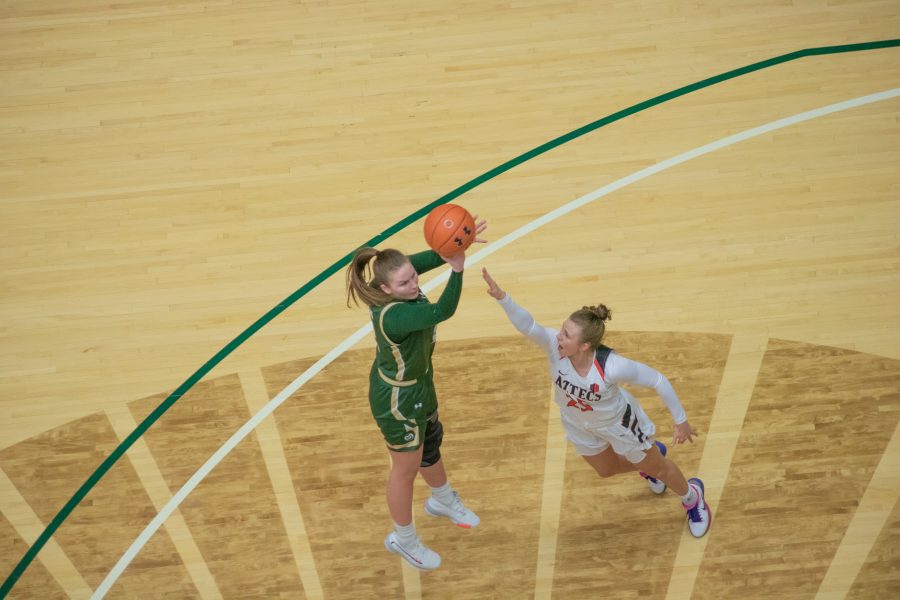 Jamie Bonnarens (12) takes a jump shot over a defender, during the Colorado State home game vs San Diego State University. CSU falls in overtime 64-61. (Devin Cornelius | Collegian)