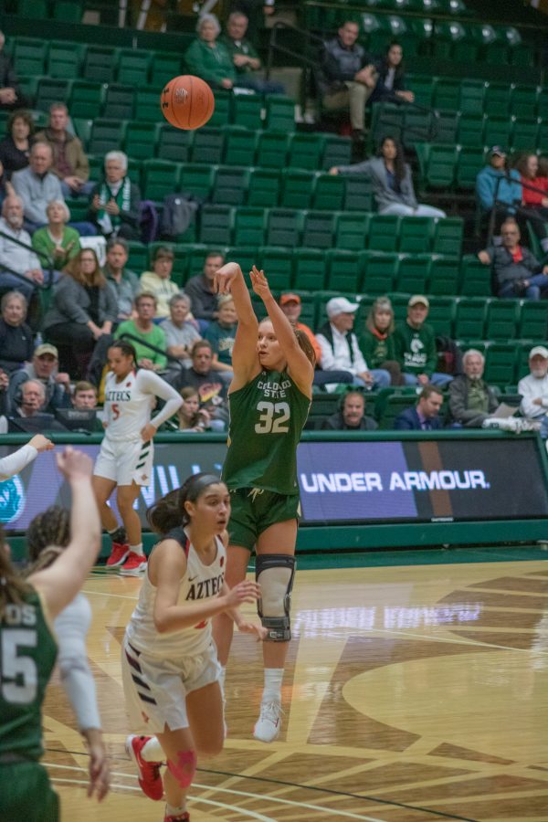Andrea Brady (32) takes a three point shot, during the Colorado State home game vs San Diego State University. CSU falls in overtime 64-61. (Devin Cornelius | Collegian)
