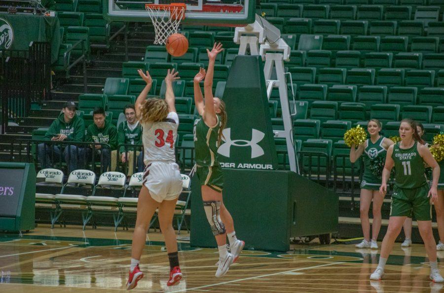 Andrea Brady (32) attempts to block a shot from a San Diego State Player, during the Colorado State home game vs SDSU. CSU falls in overtime 64-61. (Devin Cornelius | Collegian)
