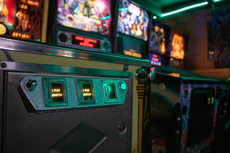 The quarter slot of a pinball machine at Pinball Jones. People can play the pinball machines for a quarter. (Devin Cornelius | Collegian)