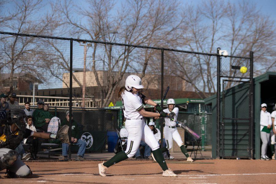 Kailyn Mcvay (8) hits the ball, during the University's game against Kennesaw State University at the Colorado State classic softball tournament on Mar. 6, 2020. CSU loses 1-3. (Devin Cornelius | Collegian)