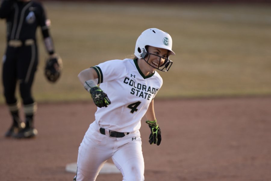 Ashley Michelena (4) smiles as she runs towards home plate, during the University's first game against Purdue University at the Colorado State classic softball tournament on Mar. 6, 2020. CSU wins 11-5. (Devin Cornelius | Collegian)