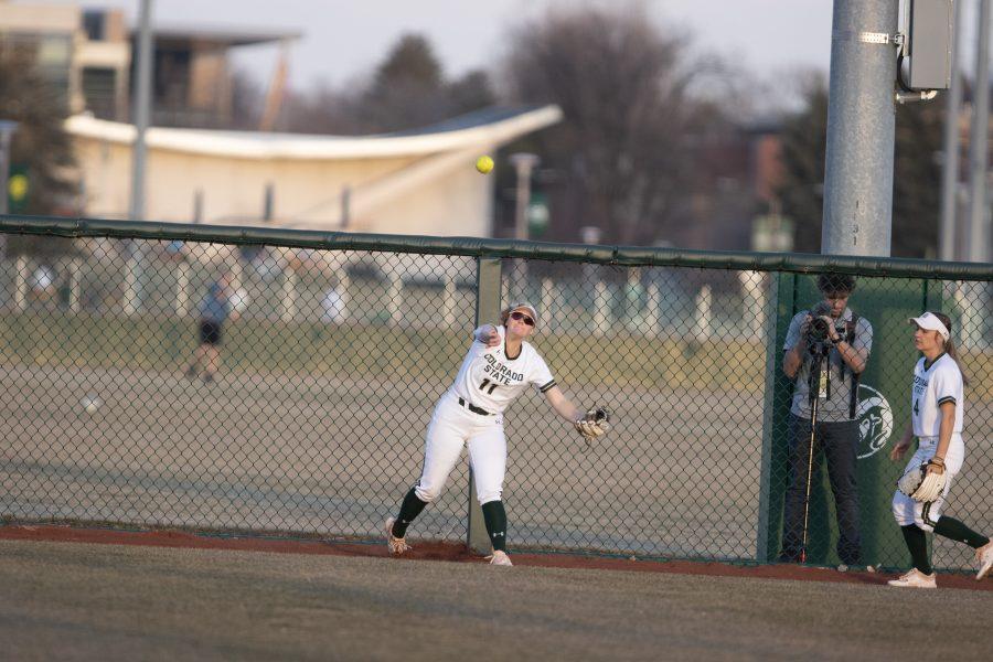 Tara Shadowen (11) throws the ball towards the infield, during the University's first game against Purdue University at the Colorado State classic softball tournament on Mar. 6, 2020. CSU wins 11-5.  (Devin Cornelius | Collegian)
