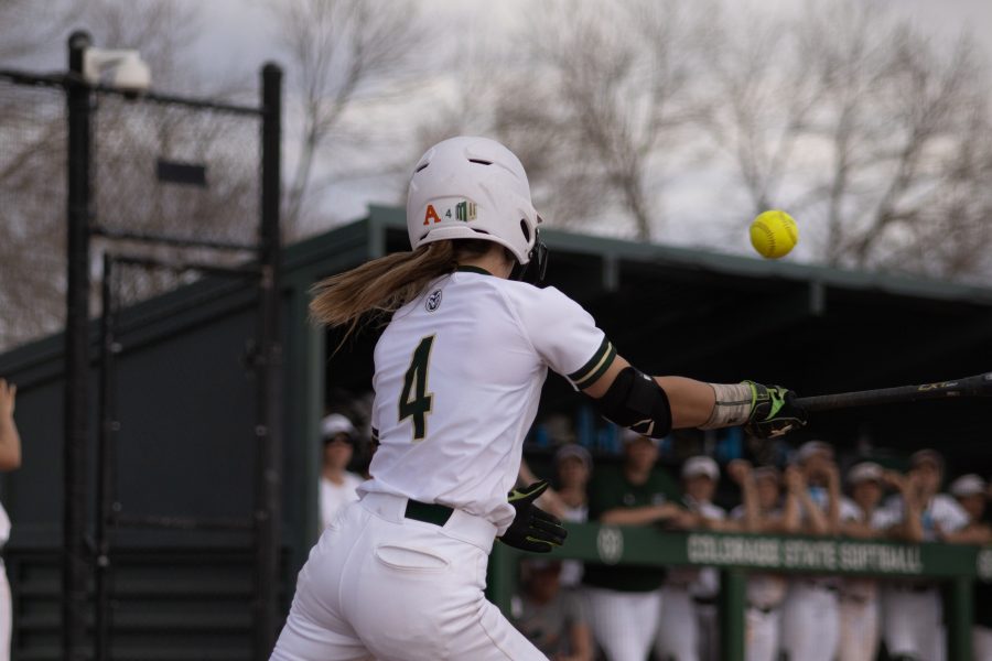 Ashley Michelena (4) hits the ball towards left field, during the University's second home game vs Purdue University at the Colorado State classic softball tournament on Mar. 6, 2020. CSU wins 4-3. (Devin Cornelius | Collegian)
