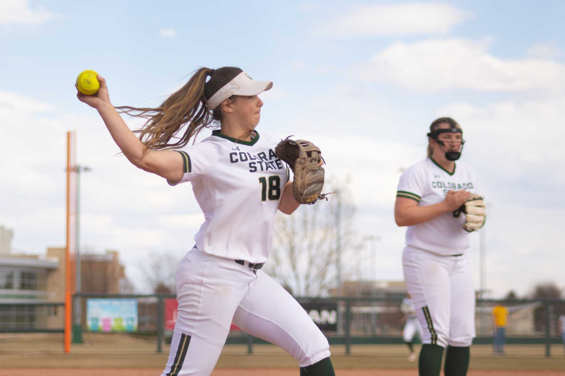 Ashley Ruiz (18) throws the ball to first base