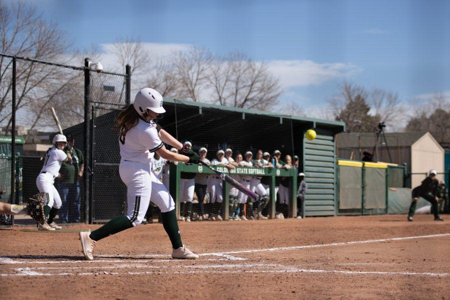 Colorado State University softball player Kailyn McVay (8) hits the ball to the outfield during the University's first game against Purdue University at the Colorado State classic softball tournament on March 6. CSU won the game 11-5. (Devin Cornelius | The Collegian)