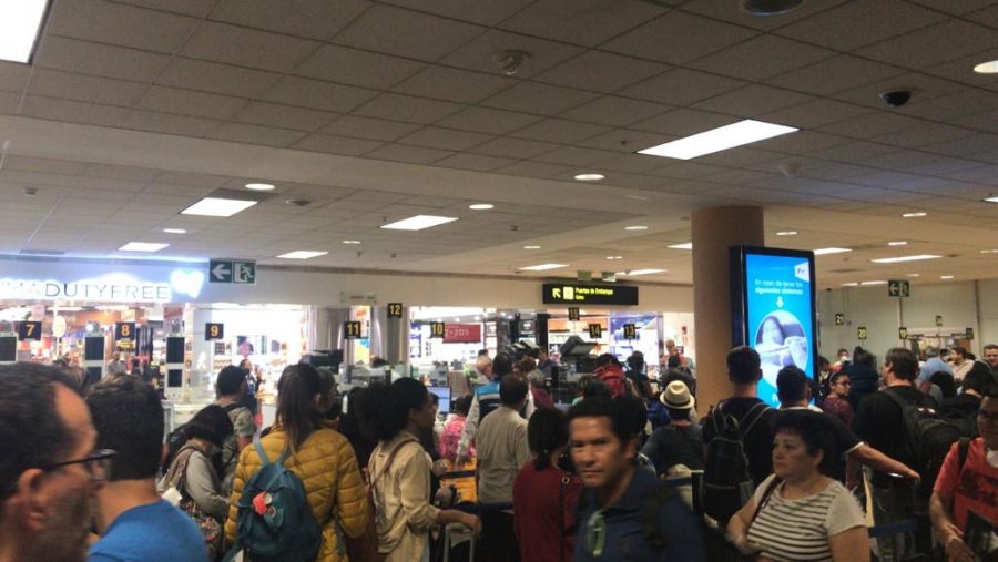 Travelers waiting in line at the airport in Lima, Peru (Photo by Sophie Flott)