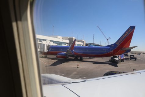 Southwest Airlines airplane parks at the terminal at Denver International Airport March 18, 2020.
