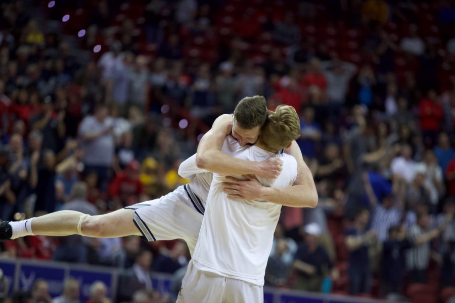 Utah State players celebrate on March 5. Through an emotional game, Utah State beat New Mexico 75-70. (Ryan Schmidt | The Collegian)
