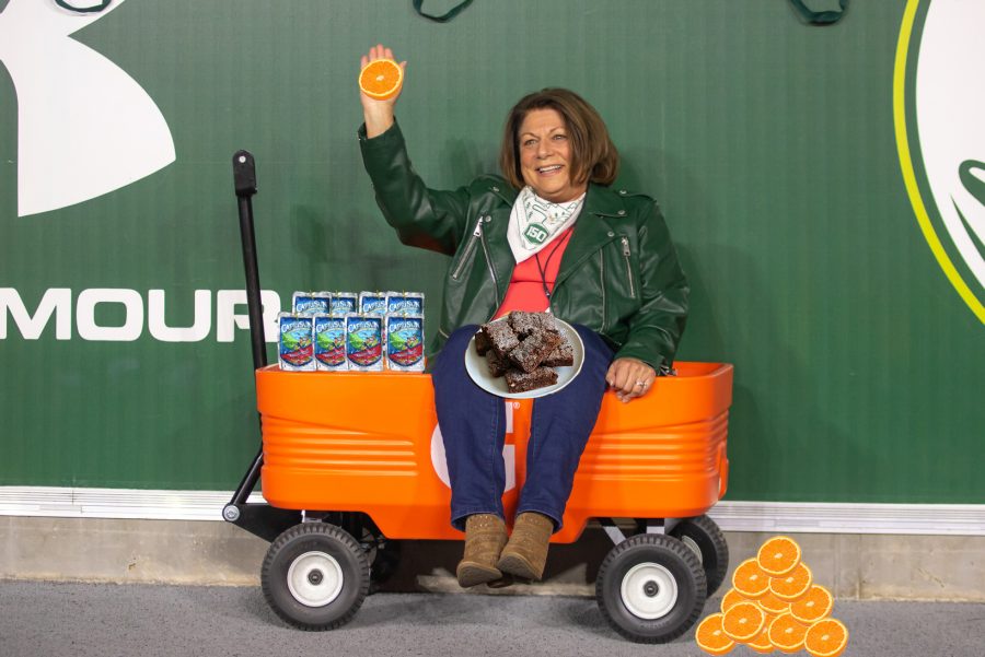 Colorado State University President Joyce McConnell awaits the December Class of 2020 students with oranges, brownies, and capri suns to congratulate them on finishing the semester. (Annie von Porcupine | The Wake Up Slap) 